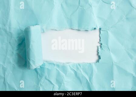 Rolled Ripped Torn Cardboard Placed Above A Wooden Classic Table Backdrop Stock Photo