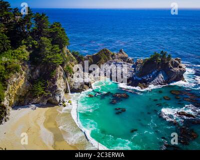 Aerial view of Water Fall McWay Falls Julia Pfeiffer Burns Park Big Sur California. McWay Falls a waterfall empties directly into the ocean. Stock Photo