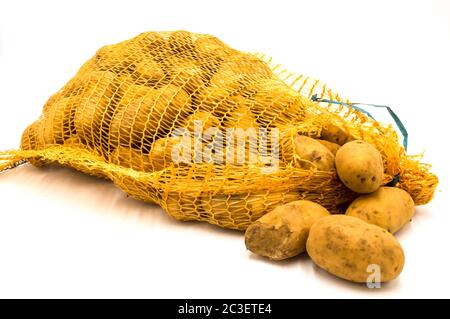Ripe potatoes in burlap sack isolated on white background Stock Photo
