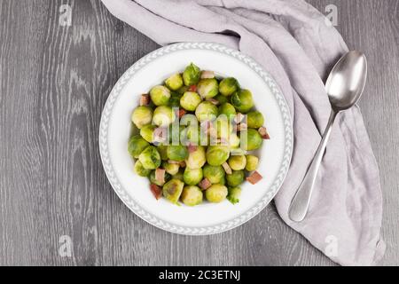 Roasted brussels sprouts with bacon. Stock Photo