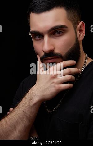 a dramatic portrait of a young serious guy Stock Photo