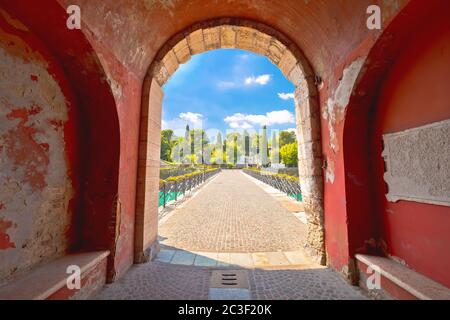 Peschiera del Garda colorful Italian town bridge and city walls entrance view Stock Photo