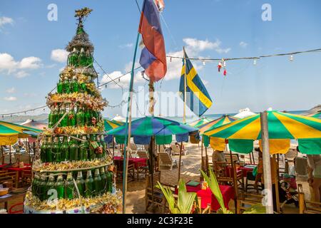 Thailand Phuket Winter 2019. Christmas tree made from bottles in a bar on a sandy beach Stock Photo