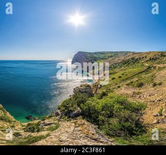 Beautiful Vasili beach in Balaklava, Sevastopol, Russia. View from the top of the rock. azure sea, sunny day clear sky background. Copy space. The con Stock Photo