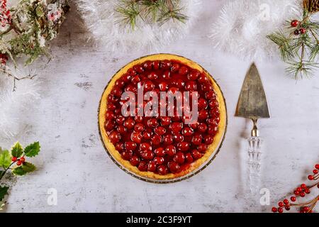 Delicious cherry pie with cherries and jelly for Christmas. Top view. Stock Photo