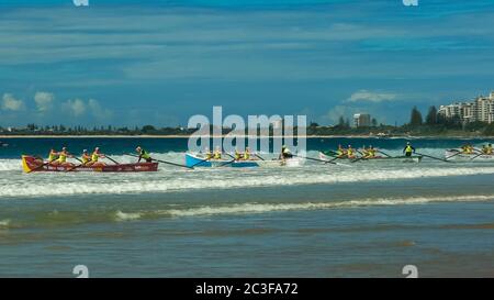 ALEXANDRA HEADLAND, QUEENSLAND, AUSTRALIA- APRIL 22, 2016: wide shot of the start of surf boat race Stock Photo