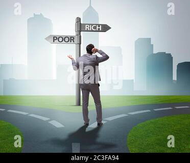 Businessman in difficult choice concept Stock Photo