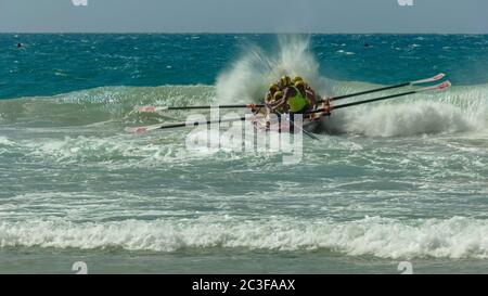 ALEXANDRA HEADLAND, QUEENSLAND, AUSTRALIA- APRIL 24, 2016: a surf boat crew at the start of a race Stock Photo