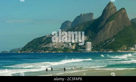 surfers paddling out at ipanema beach in rio de janeiro Stock Photo