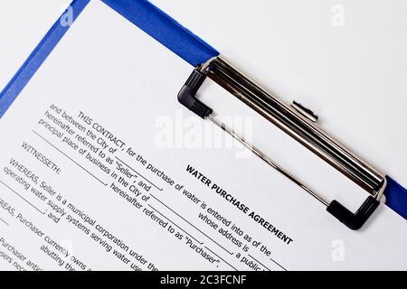 Filling and signing a water purchase agreement Stock Photo
