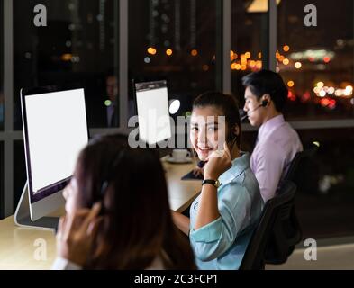 Call Center working at night. Stock Photo