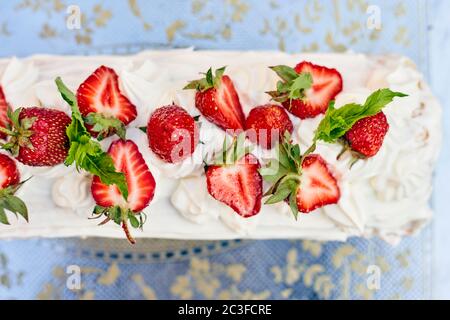 Freshly baked sweet strawberry Long-Cake Roll, also called Strawberry roulade Stock Photo