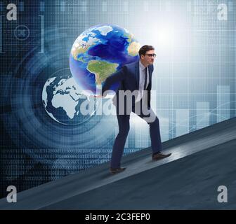 Businessman carrying Earth on his shoulders Stock Photo