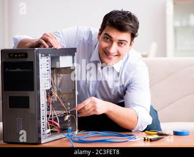 IT technician repairing broken pc desktop computer Stock Photo