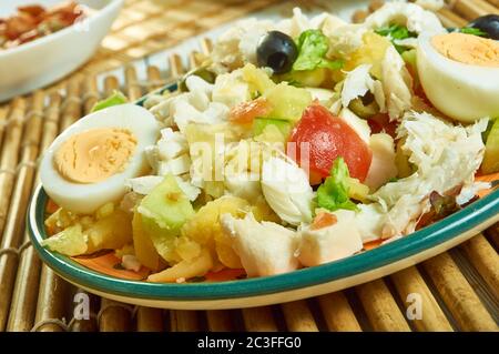 Portuguese salad with cod, potatoes. Stock Photo