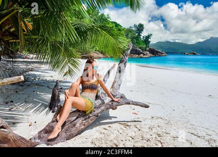 Woman on beach at Seychelles Stock Photo