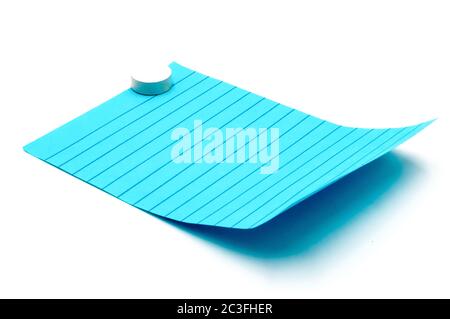 Post-it note in blue color with a magnetic washer on a white background Stock Photo