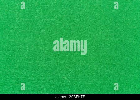 High resolution close up of bright green felt fabric texture of rough fleecy fabric of green color for backgrounds and for wallpaper an intense green Stock Photo
