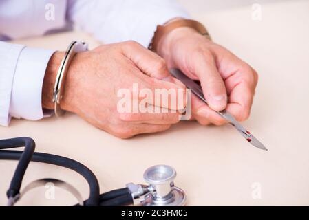 Male doctor in courthouse meeting with lawyer Stock Photo