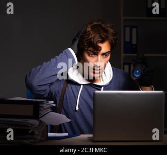 Thief trying to steal personal data in identity theft concept Stock Photo