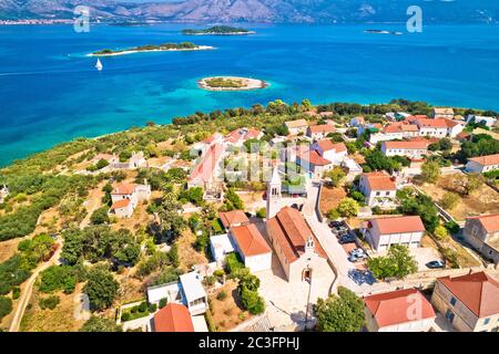 Lumbarda. Korcula island vllage of Lumbarda church and coastline aerial view Stock Photo