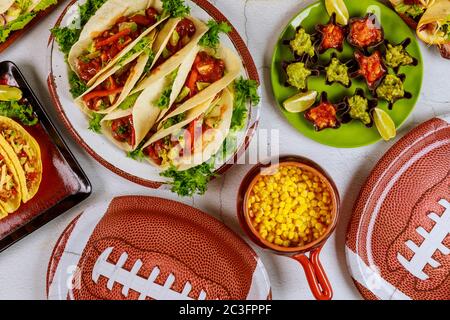 American football game concept. Catering fresh meal for fan of football game. Mexican style food. Stock Photo