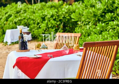 Table set up for romantic dinner on beach at Seychelles Stock Photo