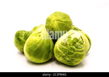 a pile of Brussels sprouts on a white background Stock Photo