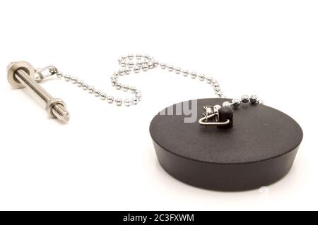 Black rubber sink stopper with chain and chrome screw on white background. Stock Photo