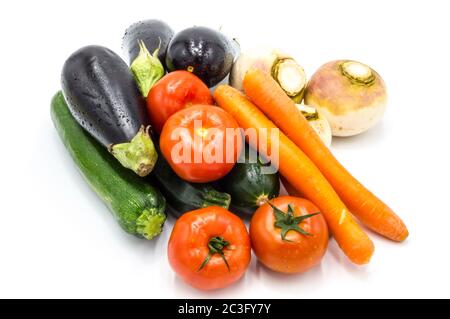 Several fresh vegetables for the preparation of a couscous on a white background Stock Photo