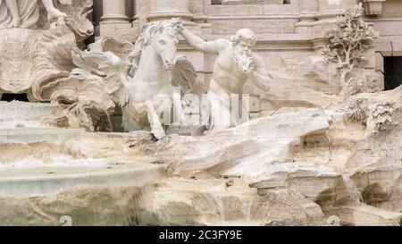 close up of a trevi fountain horse and triton statue in rome Stock Photo