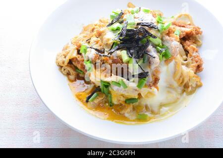 Japanese traditional food, Tonkatsu deep-fried pork cutlet on top with eggs Stock Photo