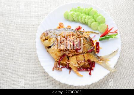 Deep Fried White Pomfret With Black Pepper Garlic, quick and easy dish. Stock Photo