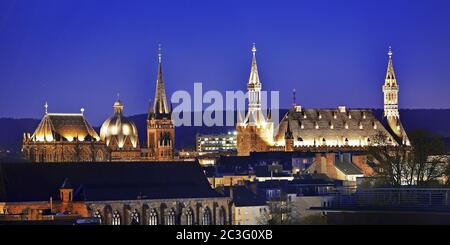 Illuminated towers of the cathedral and town hall in the evening, Aachen, Germany, Europe Stock Photo
