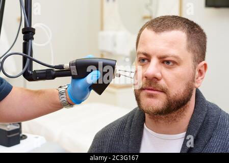 Fractional laser procedures in the clinic. Stock Photo