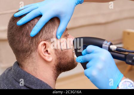 Fractional laser procedures in the clinic. Stock Photo