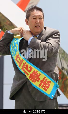 Tokyo, Japan. 20th June, 2020. Anti NHK party leader Takashi Tachibana waers a sash with his name to deliver a campaign speech for the Tokyo gubernatorial election in Tokyo on Saturday, June 20, 2020. official campaign for the July 5 Tokyo gubernatorial election with 22 candidates including Tokyo Governor Yuriko Koike started on June 18. Credit: Yoshio Tsunoda/AFLO/Alamy Live News Stock Photo