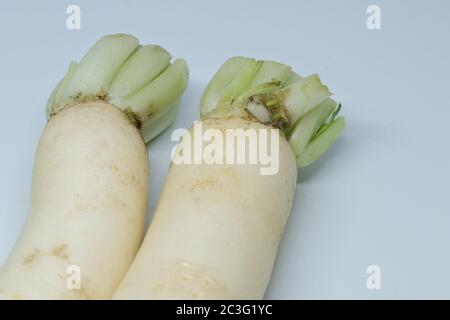 Fresh organic daikon radishes isolated on white background Stock Photo