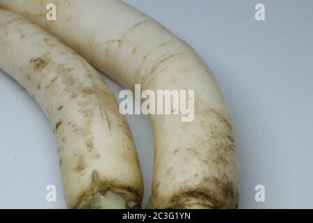 Fresh organic daikon radishes isolated on white background Stock Photo