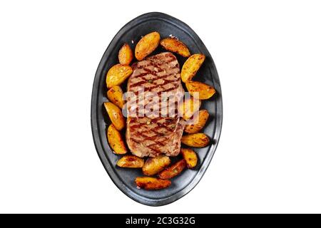 Grilled beef steak with baked potato wedges, shot from the top on a white background, isolated with a clipping path Stock Photo