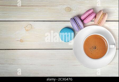 Macaroons and cup with coffee on top Stock Photo