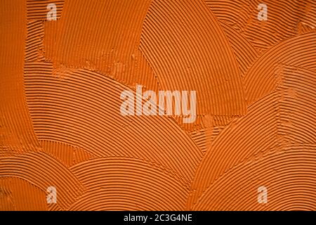 orange decorative relief plaster on wall Stock Photo