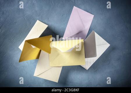 C6 glossy envelopes flying in the air, of various colors Stock Photo