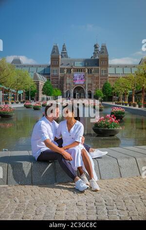 Amsterdam Netherlands April 2020, almost empty Amsterdam Rijksmuseum square during the corona covid 19 outbreak virus in Europe Stock Photo