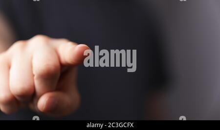 A A man hand touching virtual screen, modern background concept , can put your text at the finger, c Stock Photo
