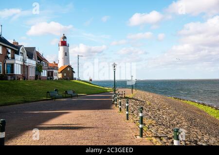 Urk Nehterlands, small fishing village Urk with is colorful lighthouse by the lake Ijsselmeer Netherlands Flevoland Stock Photo