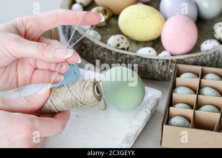 How to make hanging Easter eggs. Step by step, tutorial. Festive decor Stock Photo