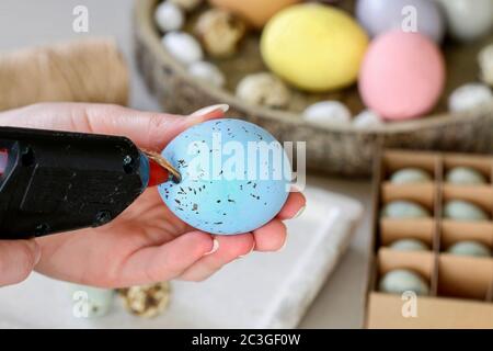 How to make hanging Easter eggs. Step by step, tutorial. Festive decor Stock Photo