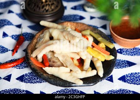 Delicious snacks pickled chilli chicken feet Stock Photo