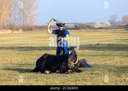 Hungarian csikos horseman in traditional folk costume Stock Photo